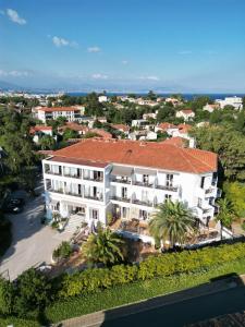 an aerial view of a large white building at Hôtel La Villa Cap d’Antibes in Juan-les-Pins
