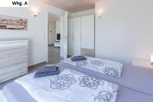 a bedroom with two beds in a room at Ferienwohnung Philip in Meersburg