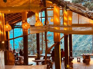 a restaurant with a view of a mountain at Belmount Ella in Ella