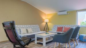 a living room with a couch and chairs at Casa Aneri by Villas Guide in Pavicini