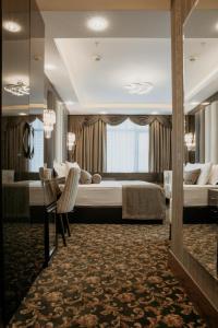 a hotel room with two beds and a table at Otel Grand Lark İstanbul in Istanbul +59 photos