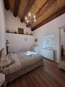 a bedroom with a bed and a wooden ceiling at Antico Chalet Momosa Maxi in Ovindoli +62 photos