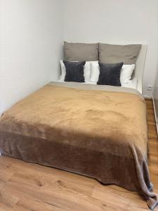 a large bed with two pillows on top of it at bei gitta in Olpe