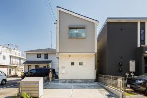 a house with a window on the side of it at Asobi Stay大日 山吹 in Nagoya