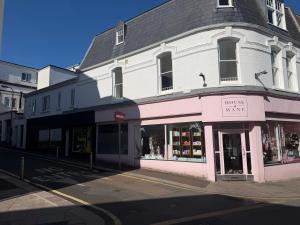 a building on a street corner with a store at 1 bedroom flat in Saint Helier Jersey