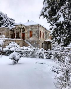 a building covered in snow at Stone Cellars in Douma +51 photos
