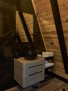 a bathroom with a sink and a mirror at Veis House in Vrba +23 photos