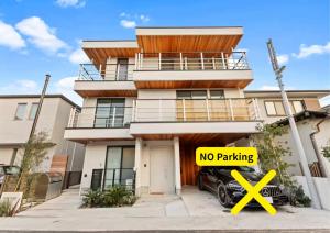 a no parking sign in front of a house at 逗子海岸テラス 2階 in Zushi