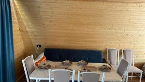 a dining room with a table and chairs at JEEK A-Frame in Tong