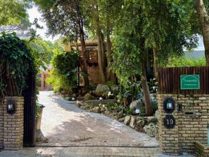 a garden path with a gate and a fence at Tranquility in Cape Town +115 photos