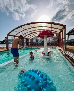 a group of people in a swimming pool at Zefirowe Wzgórze in Polańczyk