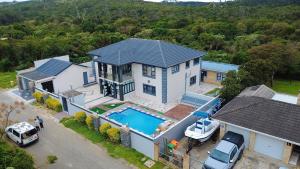 an aerial view of a house with a swimming pool at Kumnandi Guesthouse in Beacon Bay