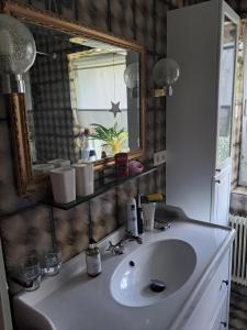 a bathroom with a sink and a mirror at Bergblick in Schwaz