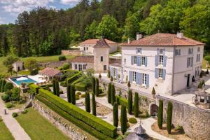 an estate in the hills with a pool and trees at Villa Privée avec Piscine - Lavy in Saint-Pierre-de-Côle