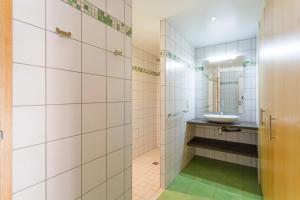 a bathroom with a sink and a mirror at L' Homillon in Saubion