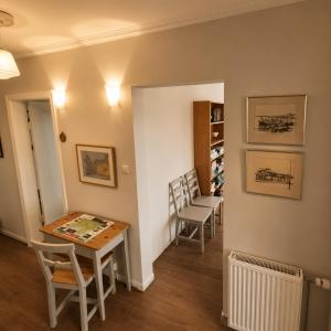 a small dining room with a table and chairs at Grindavik Guesthouse self check in & out in Grindavík +41 photos