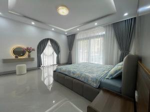 a bedroom with a bed and a window at Van Khe Cozy Villa in Hà Ðông