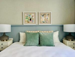 a bedroom with three pictures above a bed at Canaryislandshost I Marino in Famara