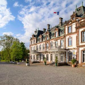 a large building with a flag on top of it at Château de Pourtalès in Strasbourg