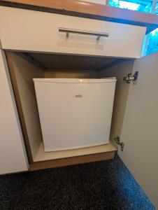 a white drawer in a closet with a door at Parkside Lodge Hotel in Camelford +22 photos