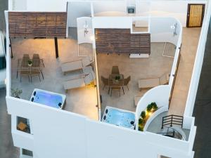 an aerial view of a house with a table and chairs at ARCH Luxury Suites in Archangelos