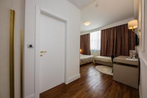 a room with a door leading to a bedroom at Art Hotel in Split