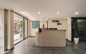a lobby with a reception desk in a building at Centoria Hotel By Urban B in Ho Chi Minh City