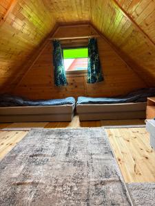 a room with two beds in a attic at Domki Lazur in Jastrzębia Góra