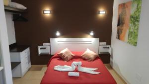 A bed or beds in a room at Residential Majada Apartments