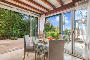 a dining room with a table and chairs at Villa Aurora with Sea View in Seravezza