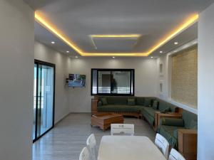 a living room with a couch and a table at DarNejib, El Wafa City, Hammamet-Nabeul in Nabeul
