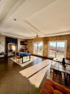 a living room with a table and a dining room at Chez les copains in Sidi Kaouki +38 photos