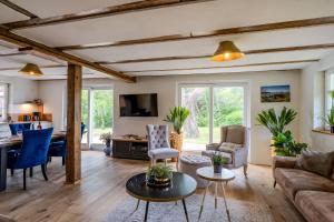 a living room with a couch and a table at Haus Tadder in Born