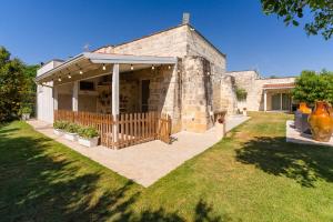 a stone house with a pavilion in a yard at Villa Queen by Perle di Puglia in Lecce