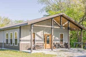 a tiny house with a pitched roof at Tall Tine Lodge in La Prairie
