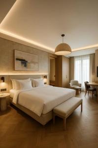 a large bedroom with a large bed and a living room at Mayott By Vilaastaa in Indore