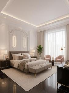 a white bedroom with a large bed and a chair at Mayott By Vilaastaa in Indore