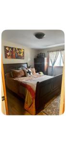 a bedroom with a large bed in a room at Chalet Havana in Namur