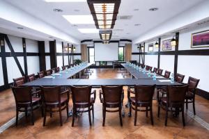 a large conference room with a long table and chairs at Hotel Skarbek in Lubin +10 photos