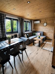 a living room with a couch and a table at Chata Bosorečka in Smižany