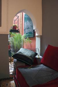 Ένα ή περισσότερα κρεβάτια σε δωμάτιο στο Riad Kantarell