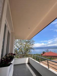 a balcony with a view of the ocean at Golden Stay in Pogradec