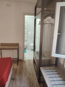 a bedroom with a bed and a bathroom with a toilet at Affittacamere Torresi in Ancona +40 photos
