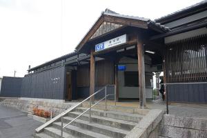 a train station with stairs in front of it at ceueu 櫟本駅 in Tenri