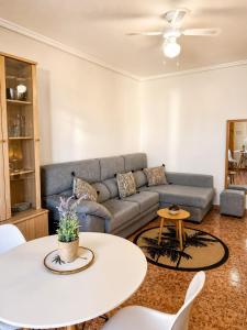 a living room with a couch and a table at Monte de Santa Pola in Gran Alacant