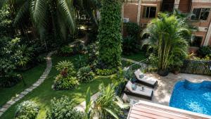 an aerial view of a garden with a swimming pool at Luxor Gardens Residences in Accra