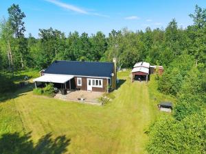 an aerial view of a house in the middle of a field at Solkullen i Kalvshult in Hallaryd
