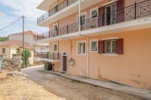 an empty street in front of a building at Paradise Sea View Apartments in Lygia