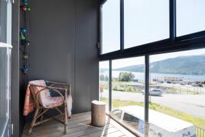 a room with a chair and a large window at View Studios in Åre