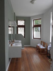 a bathroom with a sink and a mirror at L'Étape Fagnarde - Bed, Breakfast & Sauna in Spa